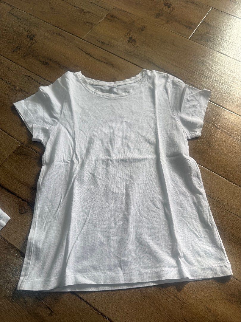 Uniqlo/Muji Tops (Category: Others Tops) located in Tagaytay City. Submitted by prelovedbytmj (Listing ID 1445470680, Image 2). Description: Lots of 4 Uniqlo and Muji Shirt/Tops . Color White and Yellow . Size Small to Medium.