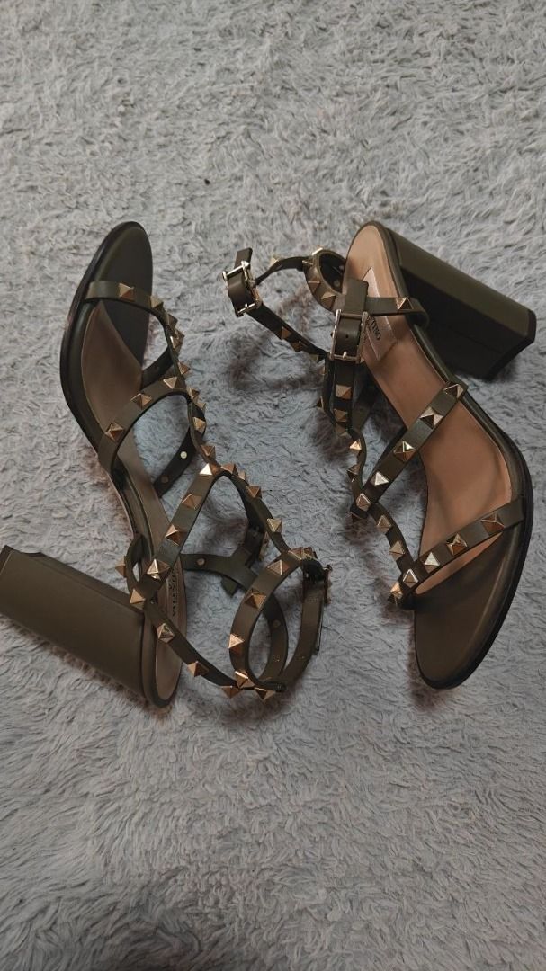 Valentino Garavani Rockstud Ankle Strap Sandal (Category: Flats & Sandals) located in Caloocan City. Submitted by finds_forkeeps (Listing ID 1445580987, Image 1). Description: - Authentic Valentino Garavani Rockstud Ankle Strap Sandal - Color: Olive Green - Size: 41 - Made in Italy - Features iconic Rockstud embellishments - Versatile for dressing up any outfit - Reason for selling: No longer worn - Original Price: $ 1,265.00.