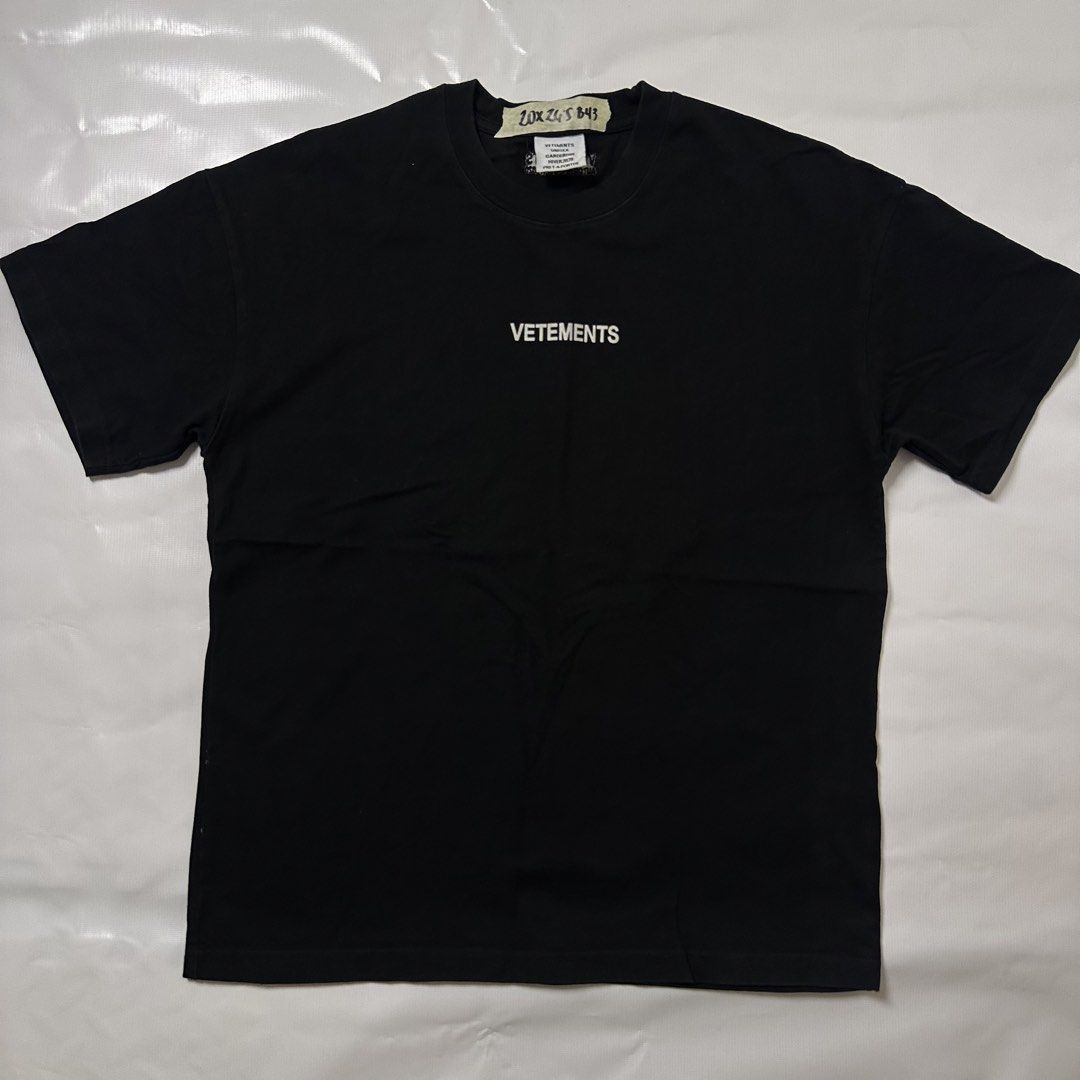 VETEMENTS Black Logo T-Shirt (Category: Tshirts & Polo Shirts ) located in Manila. Submitted by johnedel_james (Listing ID 1445556549, Image 1). Description: - Black VETEMENTS T-shirt - Features iconic VETEMENTS logo on the front - Made from comfortable material for everyday wear - Perfect for casual outfits - Check tags for material and care details.