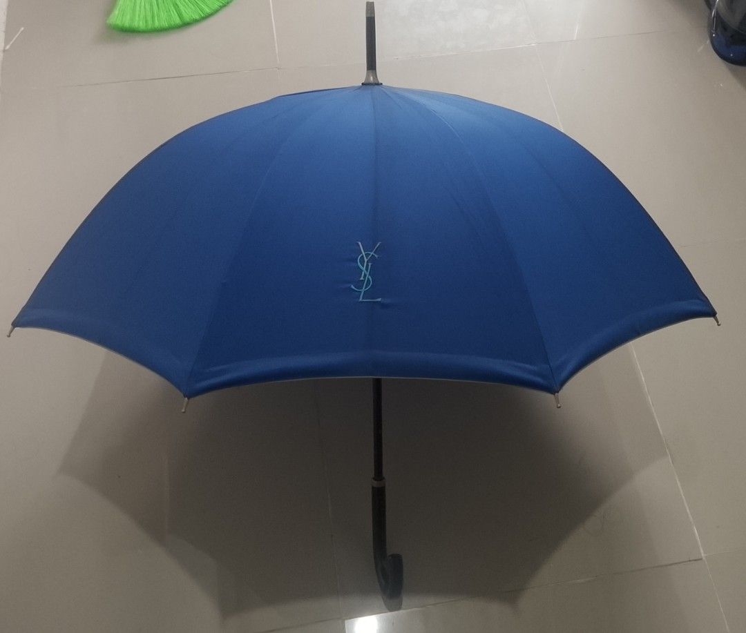 Vintage YSL umbrella (Category: Umbrellas) located in Cavite. Submitted by thrifteditem9_ (Listing ID 1445493427, Image 1). Description: vintage umbrella YSL GREAT CONDITION last 2 picture issue: dot paint minimal scratch sa handle.