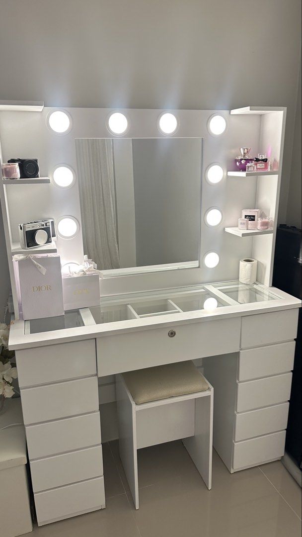 White Vanity Table with Lights and Stool (Category: Tables & Sets) located in Manila. Submitted by lenlenleynes (Listing ID 1445548380, Image 1). Description: - Elegant white vanity table set - Large mirror with 12 built-in LED lights - Comfortable matching stool included - Generous drawer space for all your essentials - Stylish glass inserts on top with organizers - Convenient switch outlet - Ideal for makeup and beauty products - Dimensions: 16