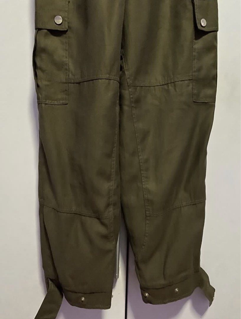 ZARA Belted Cargo Pants Olive Green (Category: Other Bottoms) located in Bacoor. Submitted by _myprelovedcloset (Listing ID 1445516767, Image 3). Description: - ZARA Olive Green Cargo Pants - Size S (EUR 36, USA 4, MEX 26) - Belted waist with silver buckle - Comfortable elasticated waistband - Two side pockets with button closure - Adjustable tie detail at the hem.