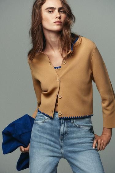 Zara Camel Cardigan with Blue Trim (Category: Others Tops) located in Quezon City. Submitted by biverse.shop (Listing ID 1445602959, Image 1). Description: - Cute camel colored cardigan - Features blue zigzag trim along neckline and hem - Button front closure - Great for pairing with jeans - Ideal for layering.