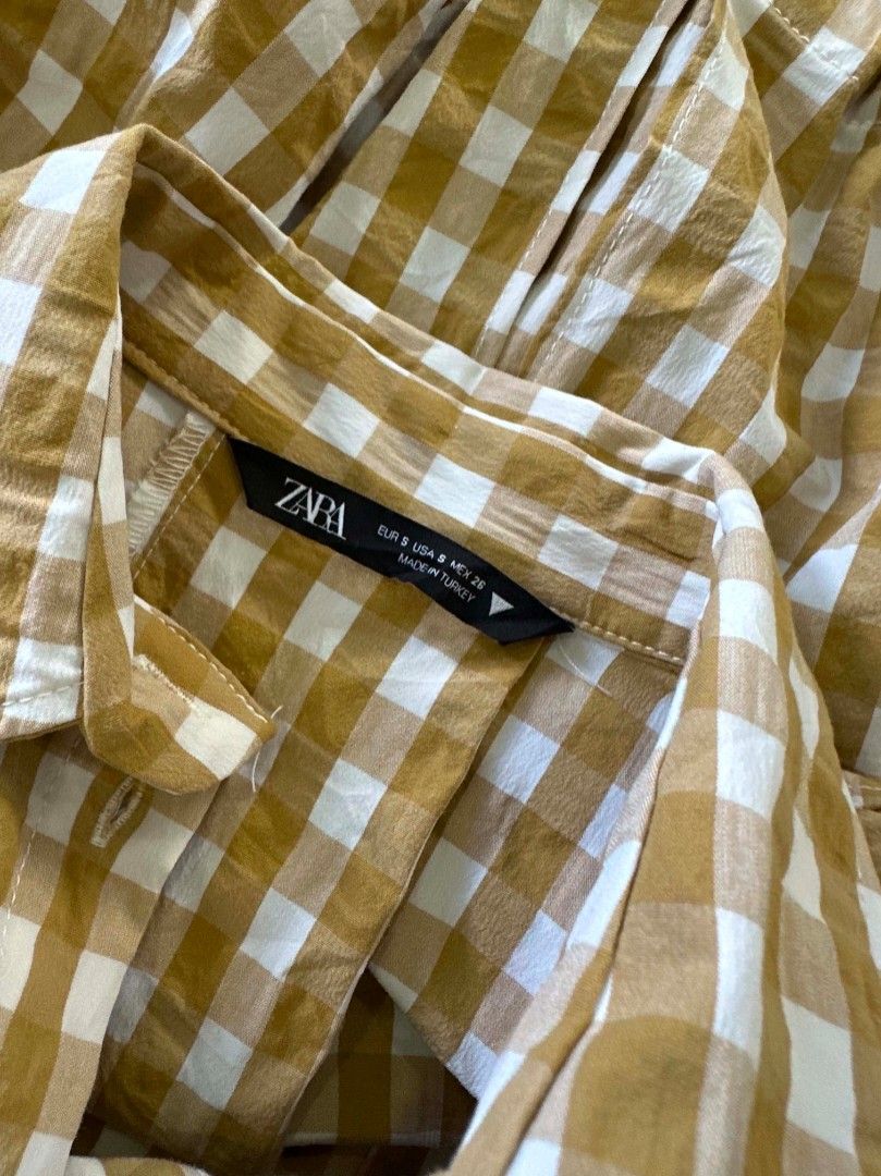 Zara (S) Cropped Flannel Gingham Shirt (Category: Shirts) located in Davao. Submitted by closetaccess (Listing ID 1445471999, Image 3). Description: - Zara yellow & white gingham semi cropped button up shirt - Long sleeves with button cuffs - Elasticated hem at the back - Two chest pockets - Pairs perfectly with high-waisted bottoms.