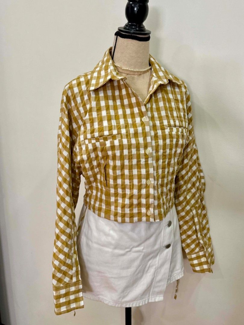 Zara (S) Cropped Flannel Gingham Shirt (Category: Shirts) located in Davao. Submitted by closetaccess (Listing ID 1445471999, Image 2). Description: - Zara yellow & white gingham semi cropped button up shirt - Long sleeves with button cuffs - Elasticated hem at the back - Two chest pockets - Pairs perfectly with high-waisted bottoms.