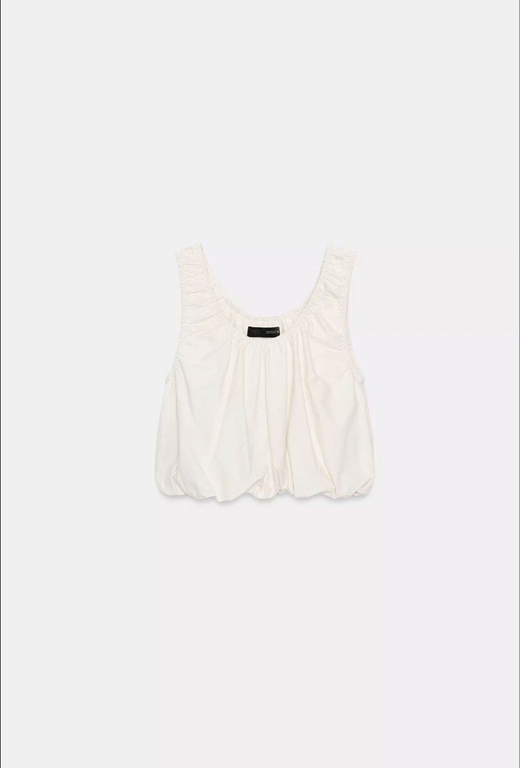 Zara Poplin Balloon Top (Category: Sleeveless) located in Pasay City. Submitted by classique_ph (Listing ID 1445563065, Image 1). Description: - Cream colored crop top - Ruched neckline - Elasticated bubble hem - Versatile for styling with jeans or skirts - Perfect for casual outings or nights out - Strictly no refund/return.