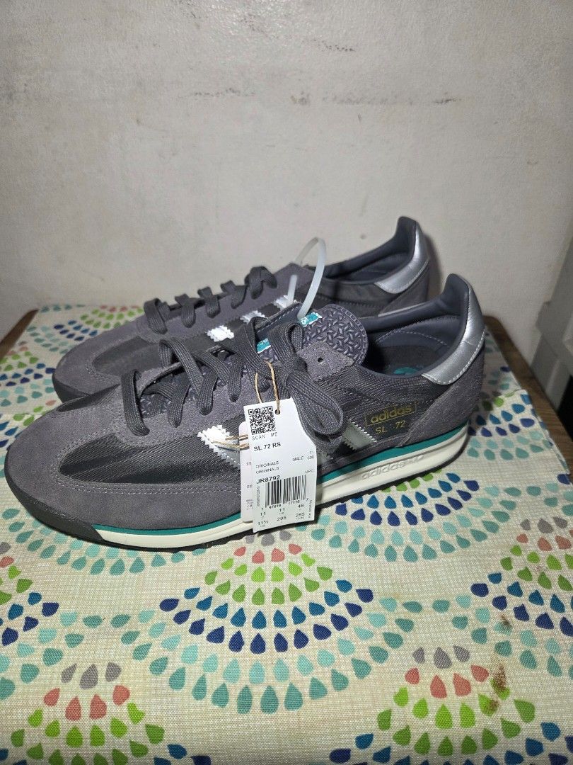 Adidas SL 72 Grey Silver Men's Sneakers (Category: Sneakers) located in Las Pinas. Submitted by milo0502 (Listing ID 1445771032, Image 1). Description: - Classic Adidas SL 72 sneakers - Grey suede and mesh upper - Iconic silver stripes - Teal accent on the midsole - Durable gum sole for excellent grip - Brand new with original tags attached - Ideal for casual and everyday wear -No Box.