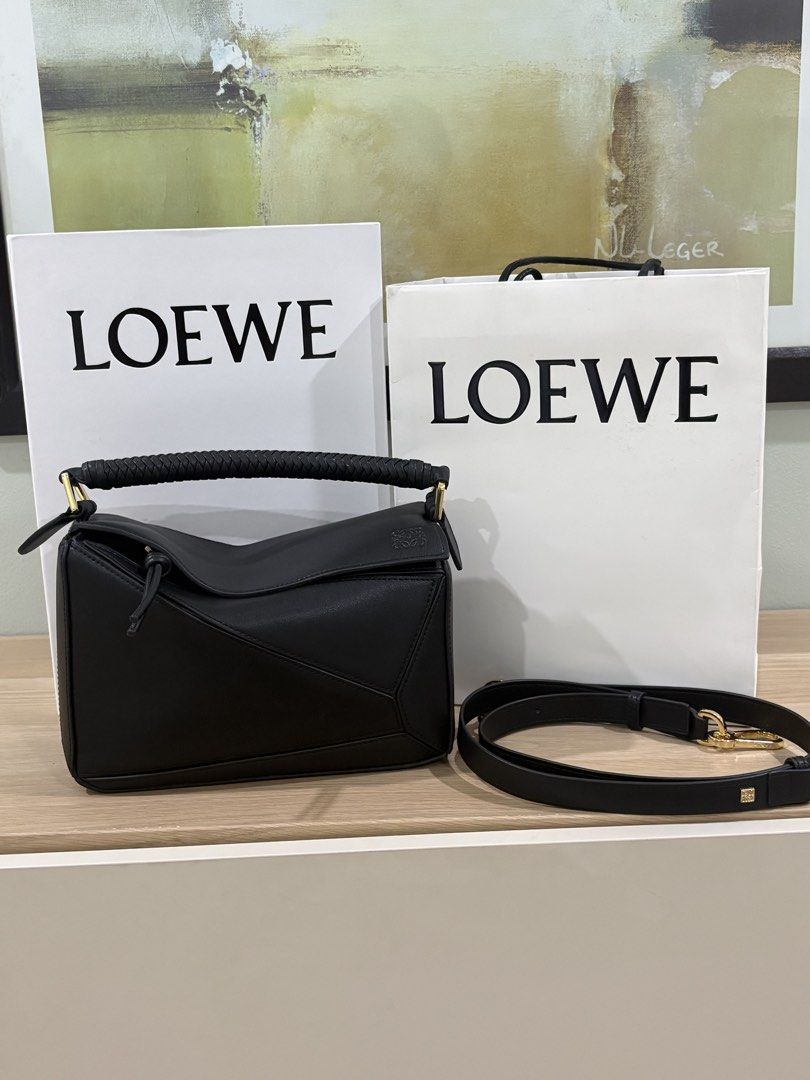 Authentic Loewe puzzle bag in black with braided handles (Category: Luxury Bags & Wallets) located in Manila. Submitted by pursonalshopper (Listing ID 1445706876, Image 1). Description: Loewe Small Puzzle Bag pre loved. COMPLETE INCLUSIONS: ✅Dustbag ✅Box & paperbag ✅Extra Loewe Sling strap ✅Authenticity card Dimensions: approximately 24 cm (width) x 16.5 cm (height) x 10.5 cm (depth), or about 9.4 x 6.5 x 4.1 inches ✈️WE SHIP NATIONWIDE ✅COD SAME