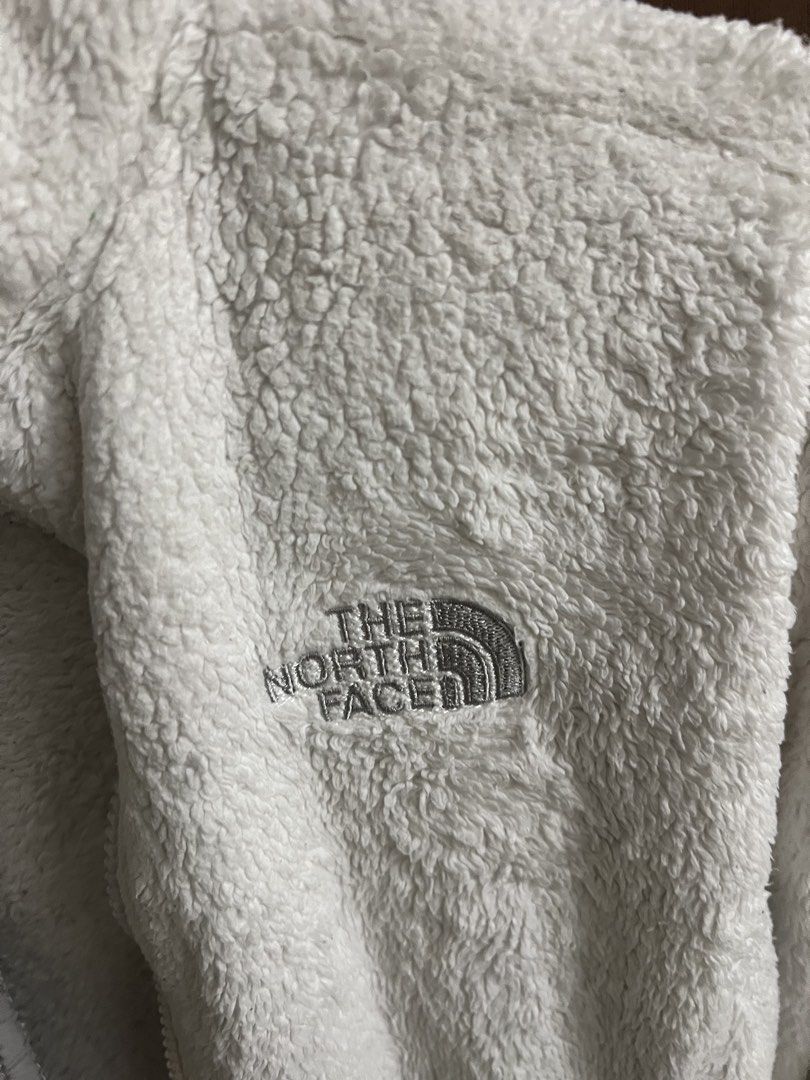 Authentic The North Face White Fleece Zip-Up Jacket Size S/P (Category: Coats, Jackets and Outerwear) located in Makati City. Submitted by prevlovedbyme (Listing ID 1445732009, Image 2). Description: - Brand: The North Face - Type: White fuzzy fleece jacket - Features: Full zip-up front, pockets, grey trim on zipper and collar - Size: S/P - Benefits: Super soft, warm, great for layering or wearing alone.