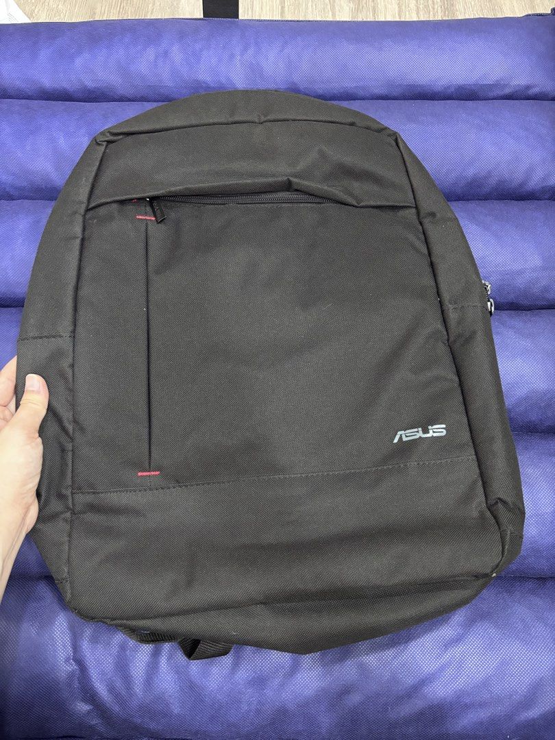 Black Asus Backpack (Category: Backpacks) located in Quezon City. Submitted by foreverj.ph (Listing ID 1445648273, Image 1). Description: - Stylish black Asus backpack - Convenient front zip pocket - Large main compartment for ample storage - Padded straps for maximum comfort - Unique pink top loop detail - Ideal for school, work, or everyday use -Used 1x and stored prperly.