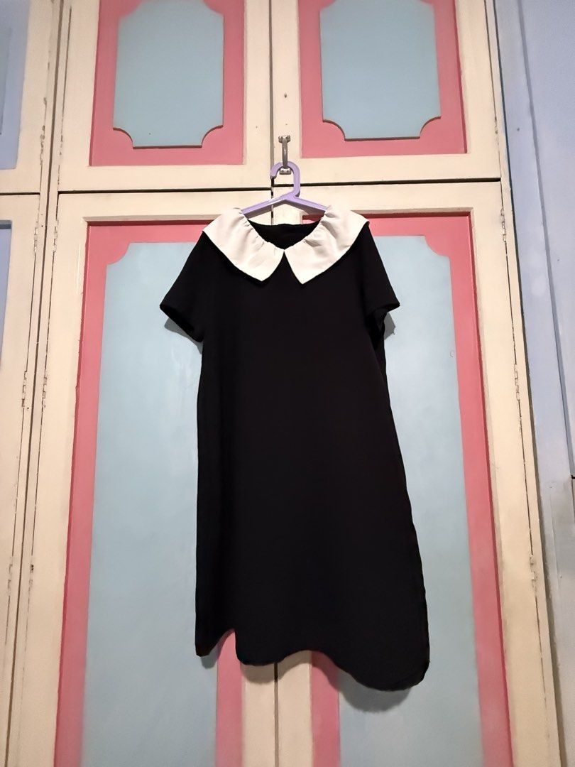 Black Dress with White Peter Pan Collar (Category: Dresses) located in Manila. Submitted by prelovedbyshai_116 (Listing ID 1445631598, Image 1). Description: - Simple black dress - Adorable white Peter Pan collar - Short sleeves - Fabric with a nice drape - Versatile for casual or dressed-up occasions - Easy to accessorize -Fits medium.
