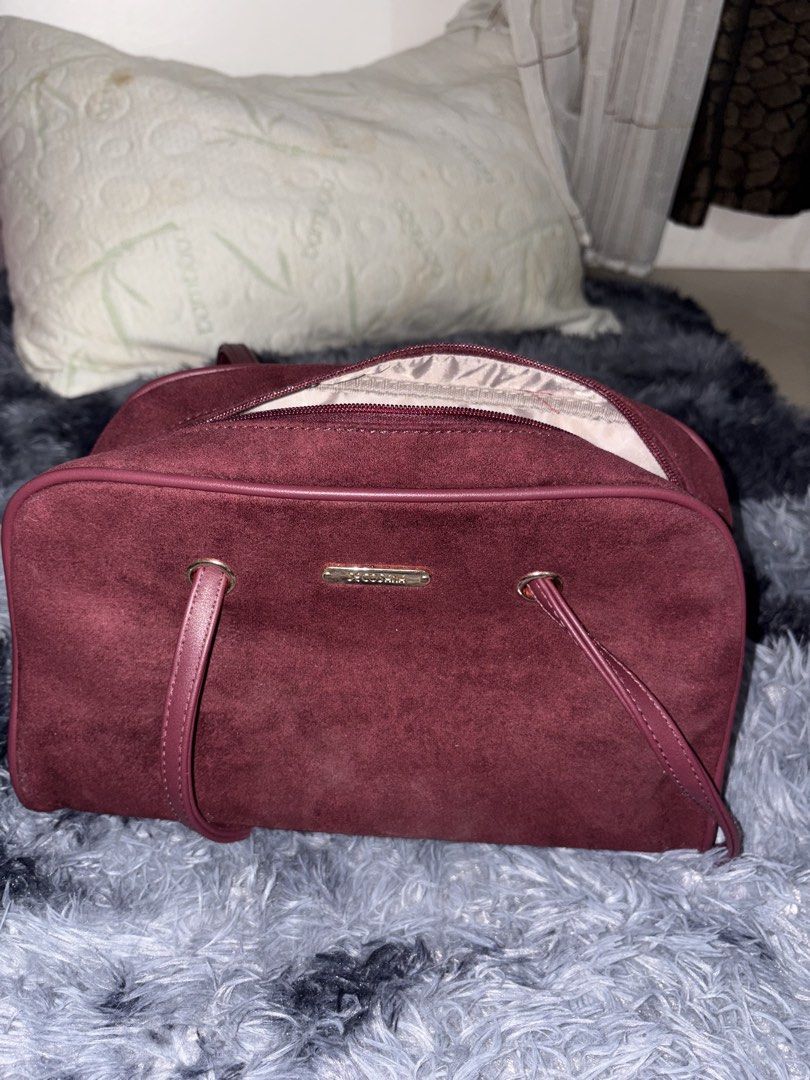 Borghese Burgundy Suede Shoulder Bag (Category: Shoulder Bags) located in Manila. Submitted by faststone_6abf86 (Listing ID 1445768651, Image 2). Description: - Burgundy suede shoulder bag from Borghese - Secure zip closure - Interior zip pocket and slip pockets - Genuine leather straps - Perfect size for daily use - Clean interior and exterior - Original price: 1,000.