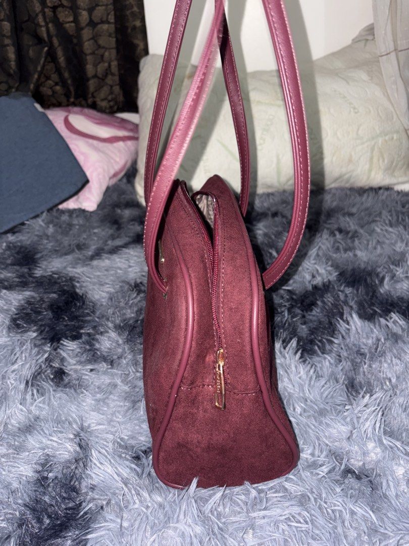 Borghese Burgundy Suede Shoulder Bag (Category: Shoulder Bags) located in Manila. Submitted by faststone_6abf86 (Listing ID 1445768651, Image 3). Description: - Burgundy suede shoulder bag from Borghese - Secure zip closure - Interior zip pocket and slip pockets - Genuine leather straps - Perfect size for daily use - Clean interior and exterior - Original price: 1,000.