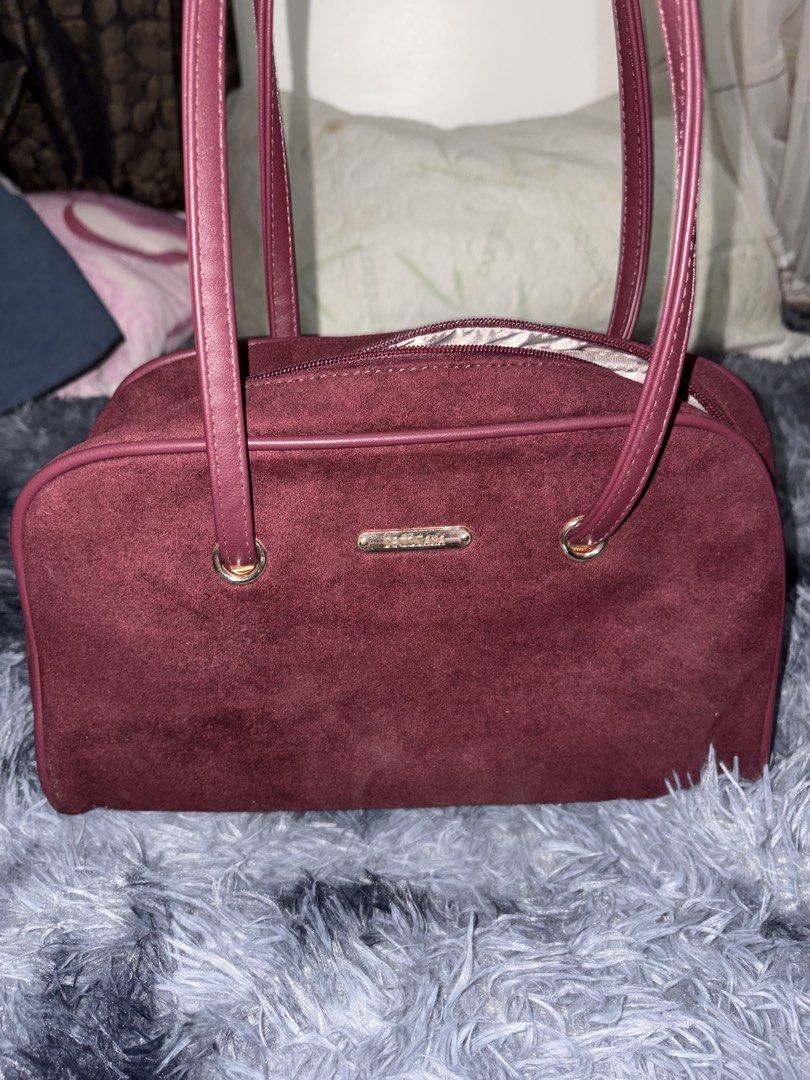 Borghese Burgundy Suede Shoulder Bag (Category: Shoulder Bags) located in Manila. Submitted by faststone_6abf86 (Listing ID 1445768651, Image 1). Description: - Burgundy suede shoulder bag from Borghese - Secure zip closure - Interior zip pocket and slip pockets - Genuine leather straps - Perfect size for daily use - Clean interior and exterior - Original price: 1,000.