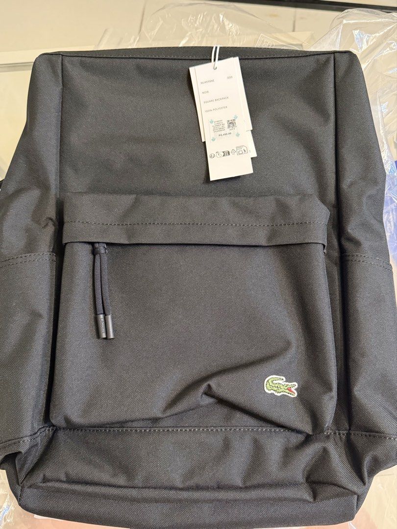 Brand new authentic Lacoste Square Backpack in Black (Noir). (Category: Backpacks) located in Pasig City. Submitted by angeltulod (Listing ID 1445714550, Image 1). Description: FOR SALE: Authentic Lacoste Square Backpack (NU4598NE) 🎒 ✅ Model: NU4598NE ✅ Color: Noir (Black) ✅ 100% Polyester ✅ Brand New with Tags ✅ Includes Original Packaging ✅ Stylish minimalist design ✅ Ideal for work, school, travel, and everyday use .