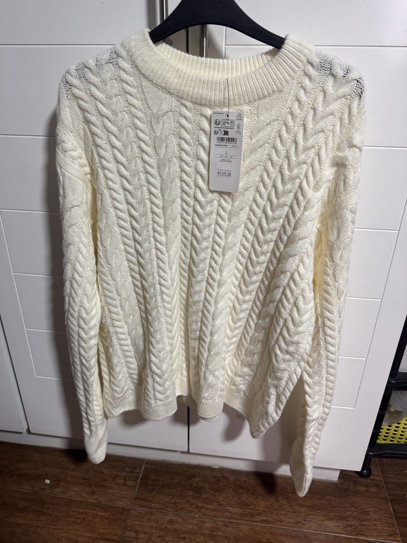 BRANDNOVA Cream Cable Knit Sweater Size L (Category: Longsleeves) located in Calumpit. Submitted by scdecluttering (Listing ID 1445652270, Image 2). Description: - BRANDNOVA cream cable knit sweater - Size: Large (L) - Classic all-over cable knit pattern - Crew neck, long sleeves - Cozy and warm, ideal for cooler weather - Great for layering or wearing solo - Original tag still attached.