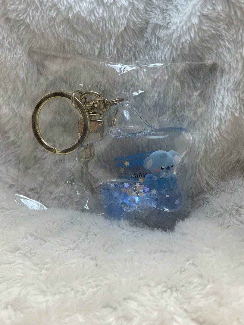 BT21 KOYA Acrylic Glitter Keyholder Keychain (Category: Character Goods) located in Quezon City. Submitted by end_less_repeat (Listing ID 1445756625, Image 3). Description: - Adorable blue KOYA keychain - Star-shaped design with glitter - Includes a gold keyring and clasp - Official BT21 merchandise - Ideal for decorating bags or keys.