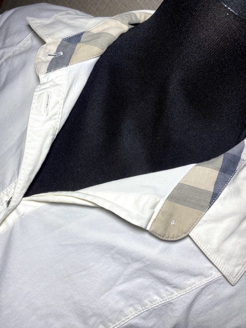 Burberry Brit Button Down Shirt with Nova Check Detail (Category: Luxury Apparel) located in Manila. Submitted by francl_ (Listing ID 1445740543, Image 2). Description: - AUTHENTIC Burberry Brit white long-sleeved shirt - SRP (20,000+ php) - Button-up front - Cinched waist detail - Note: Faint yellowing on collar and small mark on back near collar (not that visible) (can be fixed w washing) - RFS: decluttering.