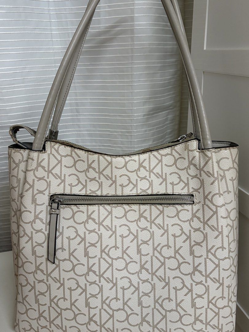 Calvin Klein Shoulder/ Office Bag (Category: Shoulder Bags) located in Antipolo. Submitted by 210user (Listing ID 1445761138, Image 2). Description: READ - see photos for flaws - aside from the chipping leather, zippers and handle are still in a good condition • no return and refund • payment first policy message me for inquiries! payment: gcash delivery: sdd .