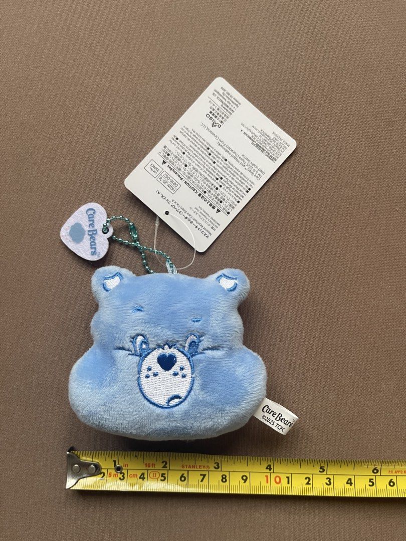 Care Bears Blue Bear Plush Keychain with Tag (Category: Plushies & Soft Toys) located in Manila. Submitted by shopandscore (Listing ID 1445688230, Image 3). Description: - Adorable blue Care Bear plush keychain - Original tag still attached - Small size, ideal for decorating bags or keys - Made with soft, huggable material - Part of the beloved Care Bears collection - Manufactured in China.