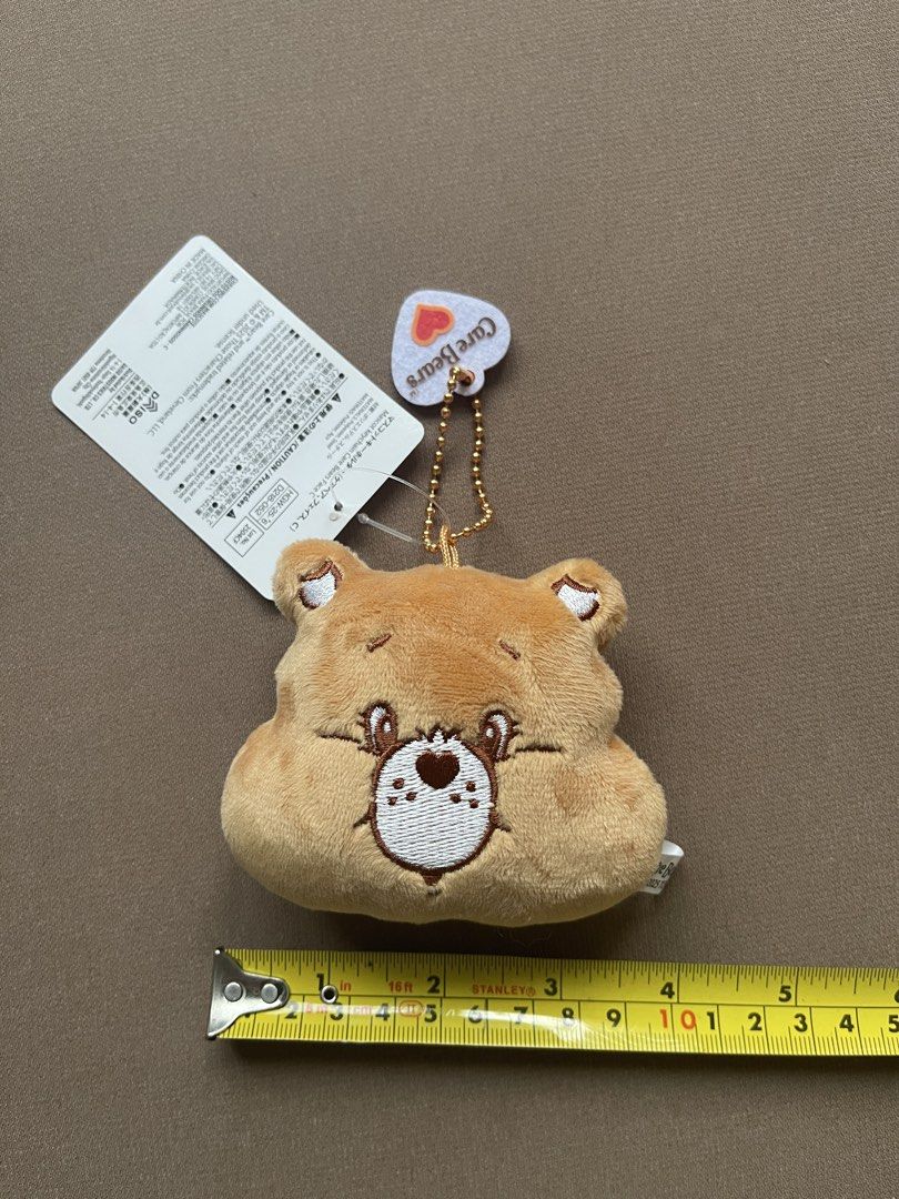 Care Bears Brown Bear Plush Keychain with Tag (Category: Plushies & Soft Toys) located in Manila. Submitted by shopandscore (Listing ID 1445687873, Image 3). Description: - Adorable brown bear plush keychain - Features official Care Bears branding - Brand new with original tag attached - Ideal accessory for bags or keys - Small and portable design.
