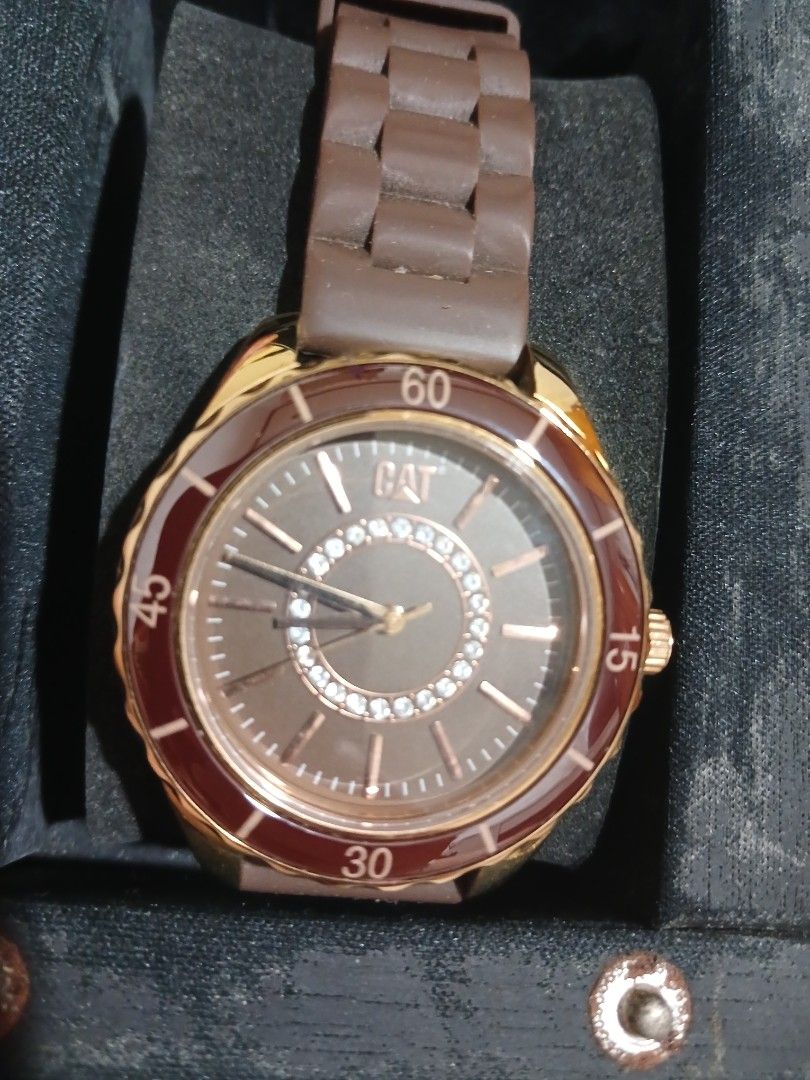 CAT Watch with Brown Strap and Rose Gold Bezel (Category: Women's Watches) located in Marikina City. Submitted by laila15 (Listing ID 1445734449, Image 2). Description: - Authentic CAT watch - Brown silicone strap - Rose gold bezel with crystal accents - Includes original CAT watch case (carbon fiber look with yellow stitching) - Ideal for everyday wear - Visit www.catwatches.com for more details -Available .
