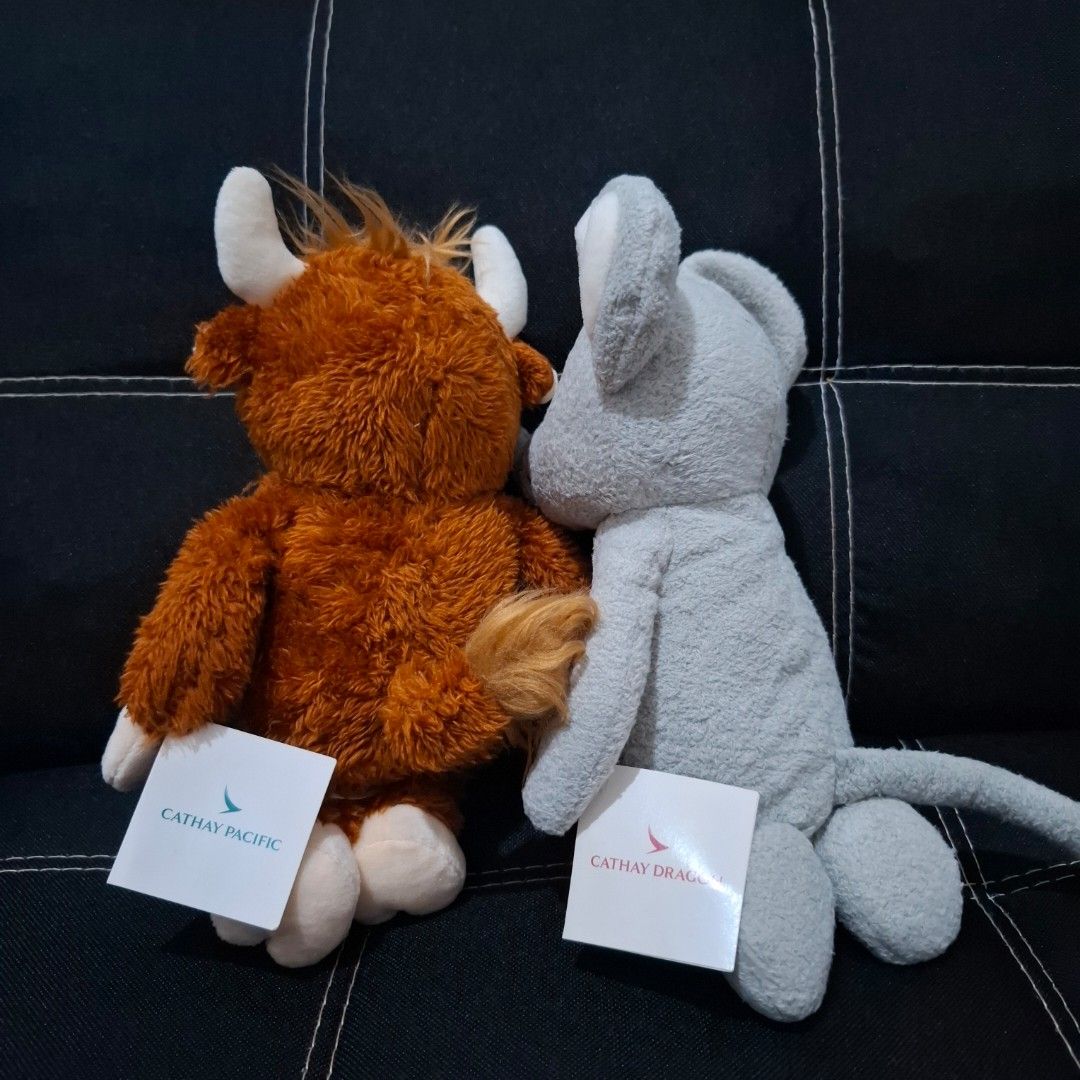 Cathay Pacific Plush Toys (Category: Plushies & Soft Toys) located in Baliuag. Submitted by ahgashop. (Listing ID 1445709702, Image 2). Description: - Adorable Year of the Rat plush from Cathay Dragon (2020) - Cute Year of the Ox plush from Cathay Pacific (2021) - Both plush toys come with original tags attached - Ideal for collectors and Cathay Pacific lovers.