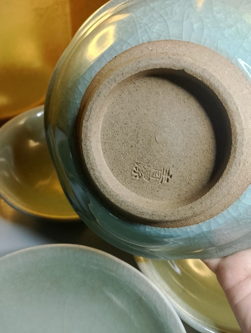 Celadon Crackle Glaze Stoneware Bowls (Category: Dinnerware & Cutlery) located in Valenzuela. Submitted by buylaaaaa (Listing ID 1445609289, Image 3). Description: - Set of 5 celadon crackle glaze stoneware bowls - Beautiful crackle pattern on glaze - Small size, perfect for sauces or appetizers - Diameter: approximately 6 inches - One bowl features a maker's mark on the bottom.