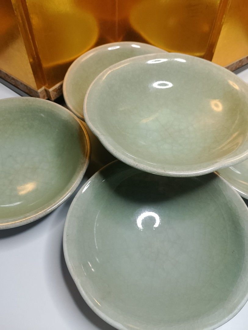 Celadon Crackle Glaze Stoneware Bowls (Category: Dinnerware & Cutlery) located in Valenzuela. Submitted by buylaaaaa (Listing ID 1445609289, Image 2). Description: - Set of 5 celadon crackle glaze stoneware bowls - Beautiful crackle pattern on glaze - Small size, perfect for sauces or appetizers - Diameter: approximately 6 inches - One bowl features a maker's mark on the bottom.
