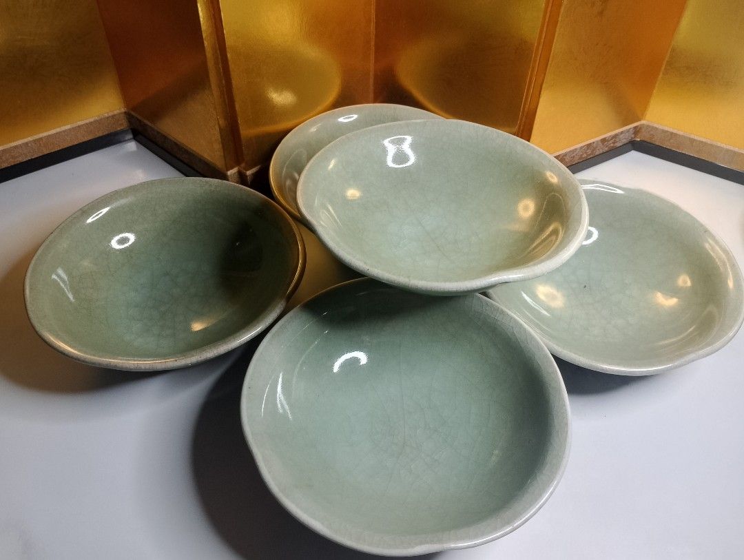 Celadon Crackle Glaze Stoneware Bowls (Category: Dinnerware & Cutlery) located in Valenzuela. Submitted by buylaaaaa (Listing ID 1445609289, Image 1). Description: - Set of 5 celadon crackle glaze stoneware bowls - Beautiful crackle pattern on glaze - Small size, perfect for sauces or appetizers - Diameter: approximately 6 inches - One bowl features a maker's mark on the bottom.