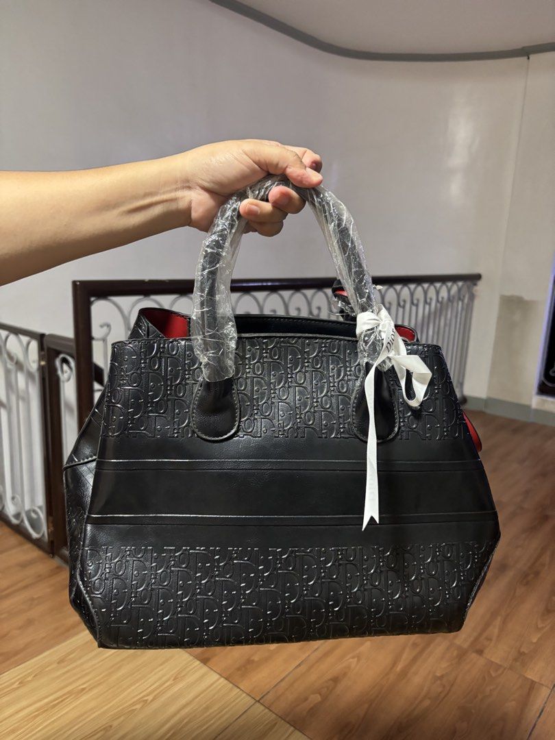 Christian Dior Black Monogram Tote Bag (Category: Luxury Bags & Wallets) located in Manila. Submitted by klatine (Listing ID 1445714730, Image 2). Description: - RFS: bag's kinda heavy on it's own - comes with strap - never used - still with dust bag - Loc: Rodriguez Rizal.