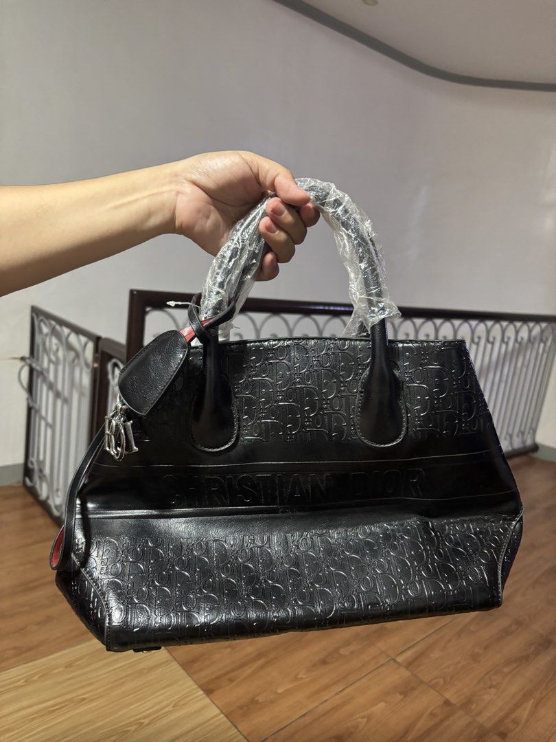 Christian Dior Black Monogram Tote Bag (Category: Luxury Bags & Wallets) located in Manila. Submitted by klatine (Listing ID 1445714730, Image 1). Description: - RFS: bag's kinda heavy on it's own - comes with strap - never used - still with dust bag - Loc: Rodriguez Rizal.
