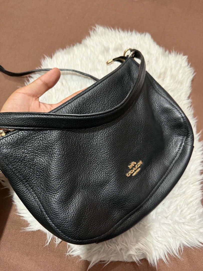 Coach Black Pebbled Leather Crossbody Bag (Category: Luxury Bags & Wallets) located in Manila. Submitted by motscollections041421 (Listing ID 1445658775, Image 3). Description: - Authentic Coach black pebbled leather crossbody bag - Elegant gold hardware details - Adjustable strap for customized comfort - Spacious interior to hold all your essentials - Clean exterior and interior, well-maintained - Timeless and versatile design, ideal for daily u
