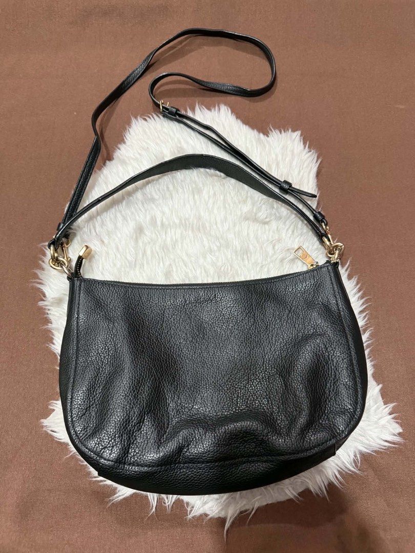 Coach Black Pebbled Leather Crossbody Bag (Category: Luxury Bags & Wallets) located in Manila. Submitted by motscollections041421 (Listing ID 1445658775, Image 2). Description: - Authentic Coach black pebbled leather crossbody bag - Elegant gold hardware details - Adjustable strap for customized comfort - Spacious interior to hold all your essentials - Clean exterior and interior, well-maintained - Timeless and versatile design, ideal for daily u