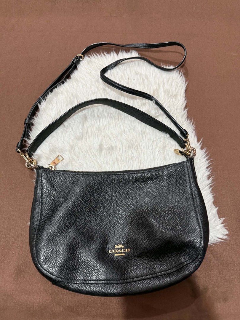 Coach Black Pebbled Leather Crossbody Bag (Category: Luxury Bags & Wallets) located in Manila. Submitted by motscollections041421 (Listing ID 1445658775, Image 1). Description: - Authentic Coach black pebbled leather crossbody bag - Elegant gold hardware details - Adjustable strap for customized comfort - Spacious interior to hold all your essentials - Clean exterior and interior, well-maintained - Timeless and versatile design, ideal for daily u