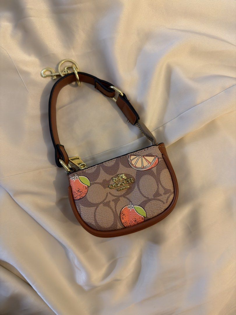 Coach Mini Bag Charms Wallet | Wallet (Category: Luxury Bags & Wallets) located in Manila. Submitted by sourcedbymissella_ (Listing ID 1445698436, Image 3). Description: MESSAGE FOR MORE INFO 750 + shipping fee shouldered by buyer 🔒 onhand! With Dustbag and Tag Brandnew 🤞🏻 - Adorable mini Coach bag charms - Available designs: Cherries, Fruit, Signature C pattern, Plain Black - Perfect for personalizing your bag or keychain - Makes a great gift