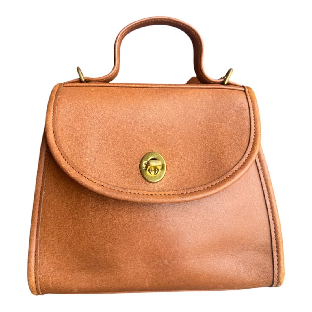 coach regina vintage Bag (Category: Luxury Bags & Wallets) located in Lingayen. Submitted by lux_thrift (Listing ID 1445722705, Image 2). Description: location pangasinan approximately 8x7 inches no major flaws signs of use only (very minor scuffs) with free dustbag.