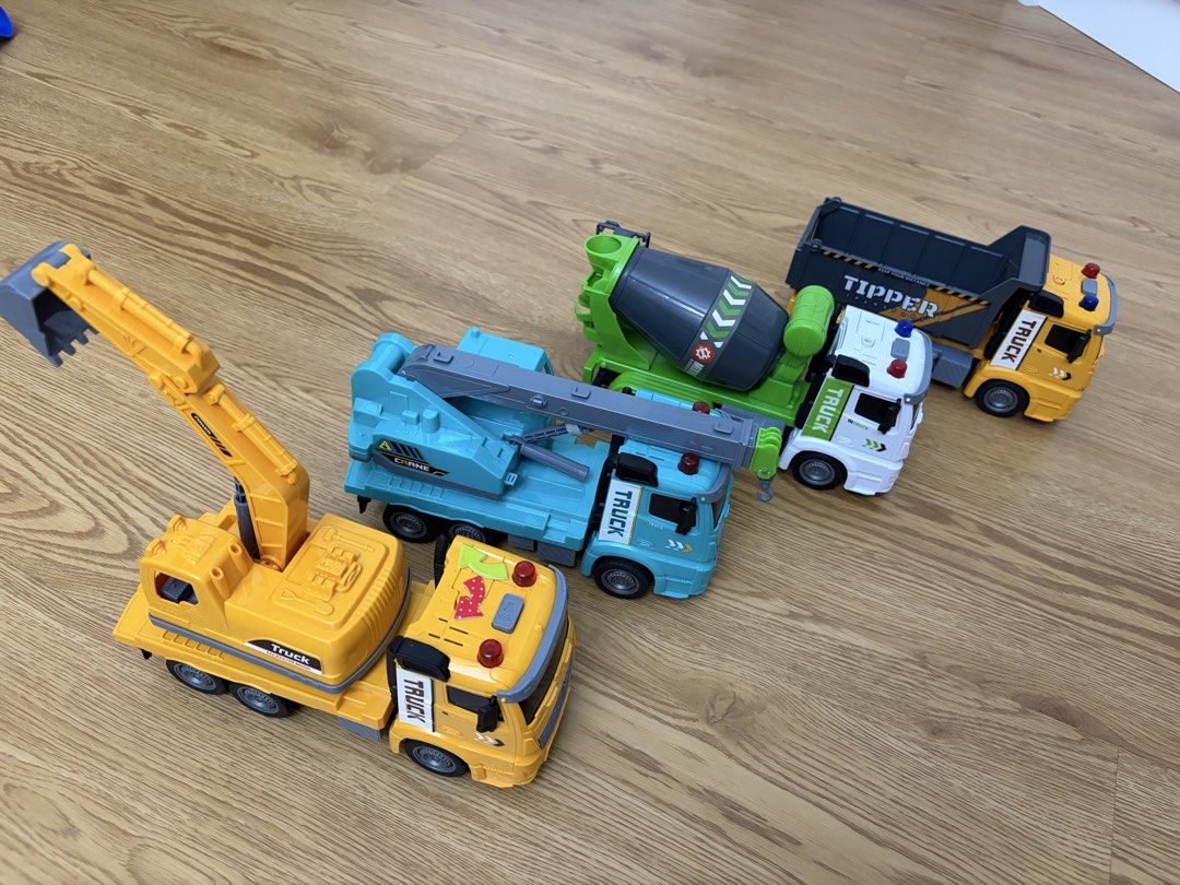 Construction vehicles set x 4 pcs (Category: Kids Toys) located in Singapore. Submitted by pukisan (Listing ID 1445644635, Image 1). Description: All light and sound working Size 24 cm x 12 cm.