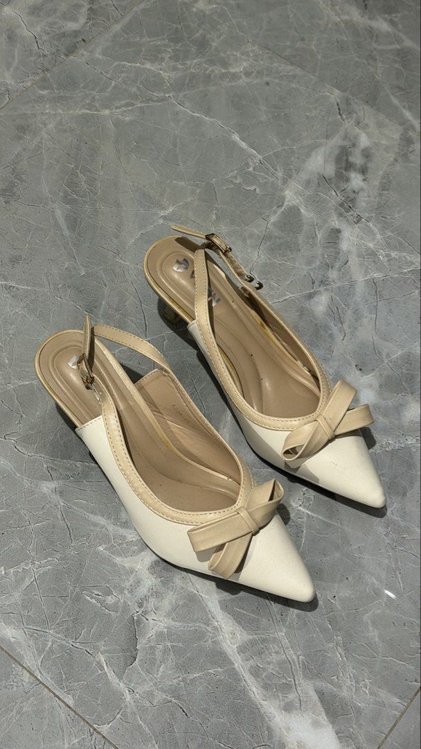 Cream Slingback Heels with Bow Detail (Category: Heels) located in Manila. Submitted by meianhey (Listing ID 1445736779, Image 1). Description: - Cute cream slingback heels - Pointed toe with a decorative bow - Adjustable strap at the back - Low heel, perfect for comfortable walking - Size: 41 - no box included.