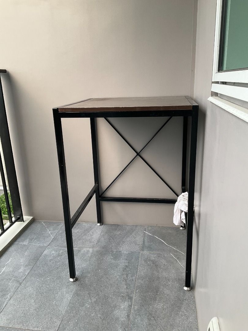 Custom-built Industrial Style Table with Metal Frame (Category: Tables & Sets) located in Caloocan City. Submitted by nicholass69897 (Listing ID 1445665917, Image 1). Description: Custom-built Industrial Style Table with Metal Frame - Size: 62 cm (L) x 60 cm (W) x 90 cm (H) - Has adjustable feet - Wood top (chipped) and metal frame - Can be a bar table or a kitchen rack location: Ortigas, Pasig.