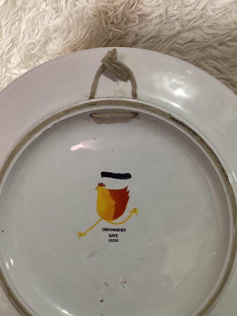 Cute Cow "Moo" Decorative Plate Handpainted (Category: Other Home Decor) located in Iloilo. Submitted by gemsuerteonlineshop (Listing ID 1445706129, Image 3). Description: - Fun decorative plate with a charming cartoon cow design. - Handpainted - Cow says "Moo!" for a playful touch. - Features a stylish blue rim and a vibrant green background with delicate flowers. - Includes a convenient string for easy hanging. - "Dishwasher Safe" and marked "0