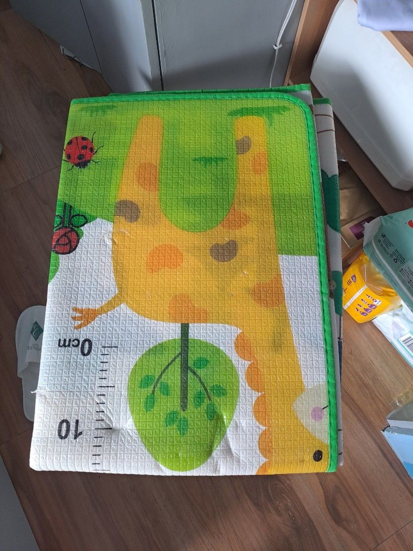 Cute Giraffe Play Mat with Measurement Markings (Category: Infant Playtime) located in Lipa City. Submitted by srms_shelves_and_closets (Listing ID 1445720071, Image 1). Description: - Adorable giraffe design with trees & ladybugs - Soft play mat for babies and toddlers - Includes measurement markings up to 10cm - Ideal for tummy time, play, and learning - Easy to clean surface - Perfect addition to any nursery or playroom.