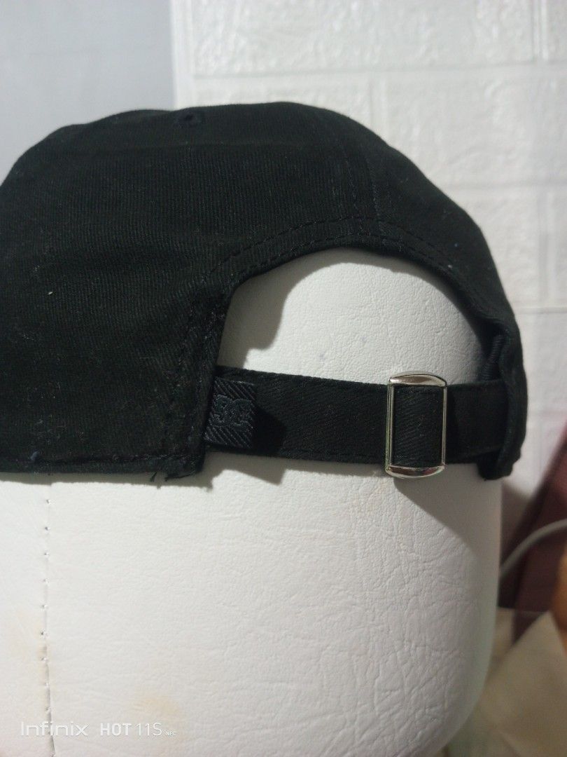 DC Shoes 1994 Black Baseball Cap (Category: Caps & Hats) located in Las Pinas. Submitted by rzzr_thrift25 (Listing ID 1445785193, Image 2). Description: - Classic black baseball cap - Features 'DC94' embroidery on the front - Small star logo detail on the side - Adjustable strap for a comfortable fit - Interior is clean and well-maintained - Ideal for everyday casual wear.