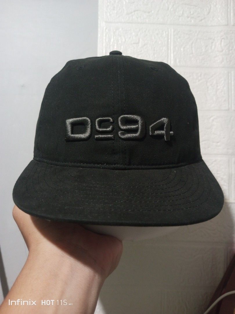 DC Shoes 1994 Black Baseball Cap (Category: Caps & Hats) located in Las Pinas. Submitted by rzzr_thrift25 (Listing ID 1445785193, Image 1). Description: - Classic black baseball cap - Features 'DC94' embroidery on the front - Small star logo detail on the side - Adjustable strap for a comfortable fit - Interior is clean and well-maintained - Ideal for everyday casual wear.