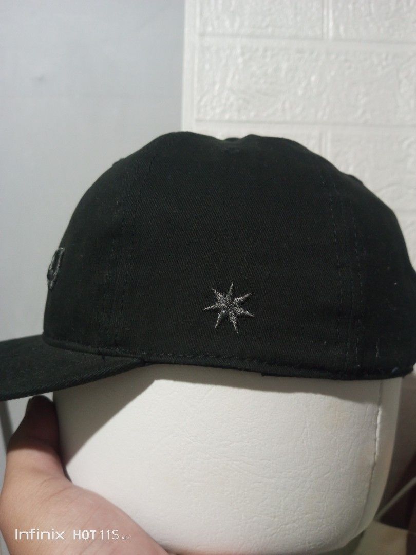 DC Shoes 1994 Black Baseball Cap (Category: Caps & Hats) located in Las Pinas. Submitted by rzzr_thrift25 (Listing ID 1445785193, Image 3). Description: - Classic black baseball cap - Features 'DC94' embroidery on the front - Small star logo detail on the side - Adjustable strap for a comfortable fit - Interior is clean and well-maintained - Ideal for everyday casual wear.