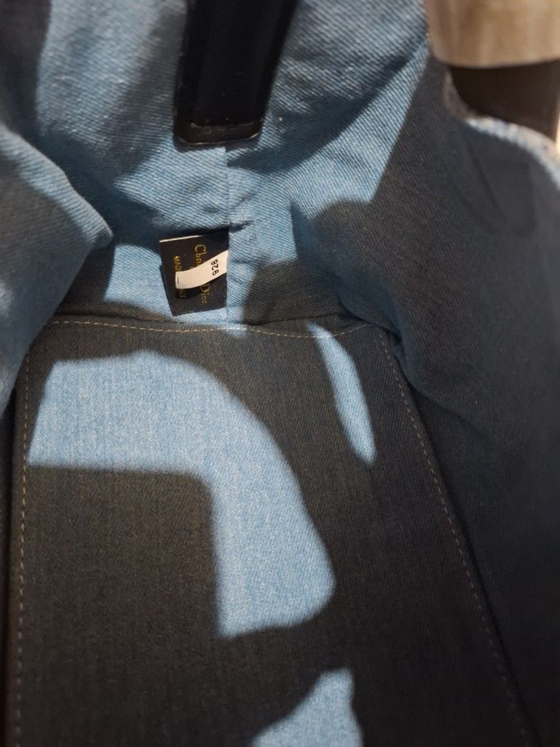 Dior Denim Monogram Tote Bag with Pouch (Category: Luxury Bags & Wallets) located in Manila. Submitted by brekkas.ph (Listing ID 1441228931, Image 3). Description: - Authentic Dior tote bag - Classic blue denim with signature monogram print - Includes a matching zippered pouch - Durable black leather handles and trim - Elegant gold-tone 'Dior' charms - Ideal for everyday style and practicality P12800.
