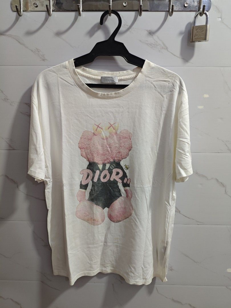 Dior Kaws Classic Unisex Tshirt (Category: Everything Else Others) located in Baguio. Submitted by jayjay_apparel01 (Listing ID 1445654760, Image 1). Description: Dior Kaws Classic Unisex Tshirt Color Rate 9/10 Print Rate 8/10 Complete Tags Cotton Tela Need Wash Size Large To XL Dimes 21 Width 27 Length Price P189.