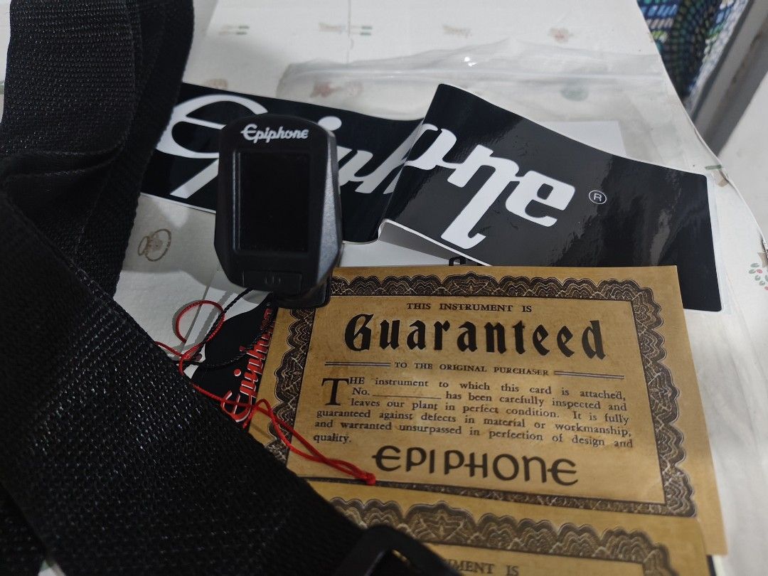 Epiphone Clip-On Guitar Tuner (Category: Musical Instruments) located in Bulacan. Submitted by babz30261 (Listing ID 1445629339, Image 2). Description: - Epiphone clip-on tuner - Works great for guitars and other instruments - Easy to attach and use - Includes original Epiphone guarantee card and stickers - Essential for any musician needing to stay in tune.