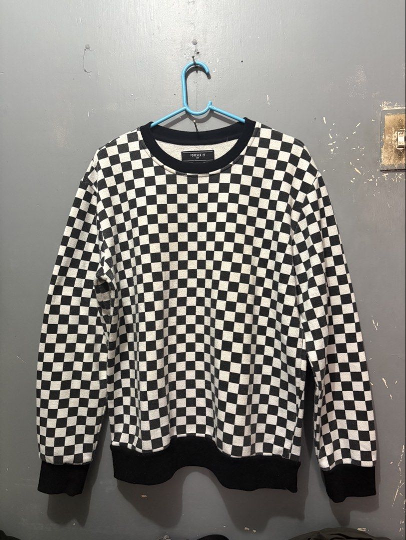 Forever 21 Black and White Checkered Sweater (Category: Coats, Jackets and Outerwear) located in Manila. Submitted by traabbb (Listing ID 1445683935, Image 1). Description: Forever 21 Men’s Sweater Color: Black and White Design: Checkered/Checkerboard Print Neckline: Crew Neck Sleeve Length: Long Sleeves Fit: Relaxed/Oversized Fit Material: Soft Knit Fabric Size: Large (L).