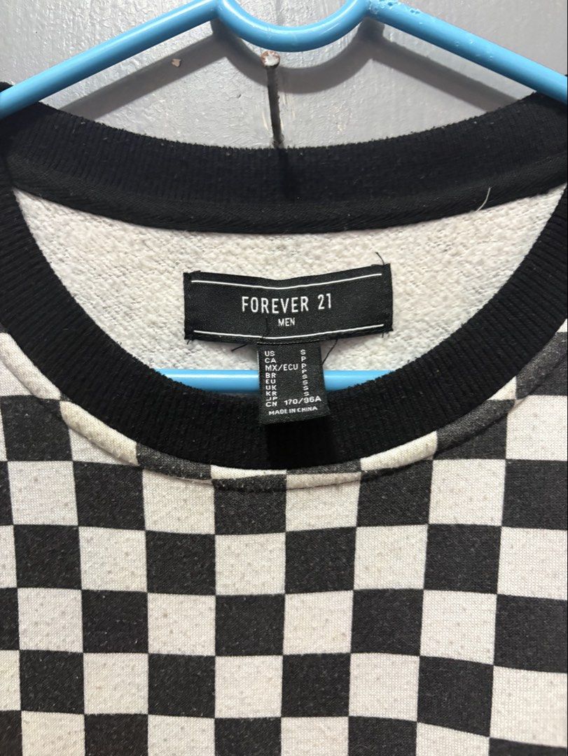 Forever 21 Black and White Checkered Sweater (Category: Coats, Jackets and Outerwear) located in Manila. Submitted by traabbb (Listing ID 1445683935, Image 2). Description: Forever 21 Men’s Sweater Color: Black and White Design: Checkered/Checkerboard Print Neckline: Crew Neck Sleeve Length: Long Sleeves Fit: Relaxed/Oversized Fit Material: Soft Knit Fabric Size: Large (L).